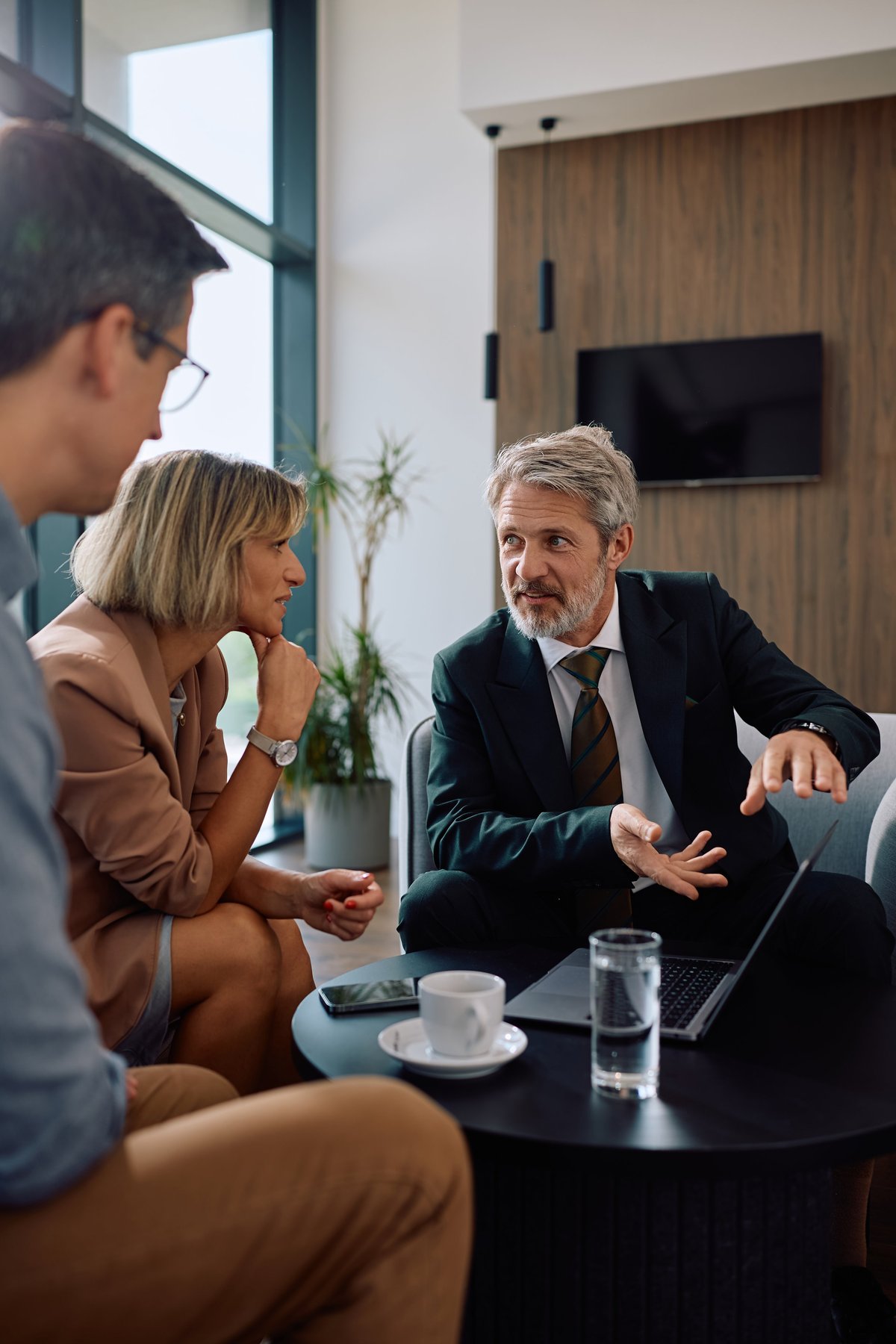 Professional tax relief team meeting with clients — trusted nationwide IRS resolution